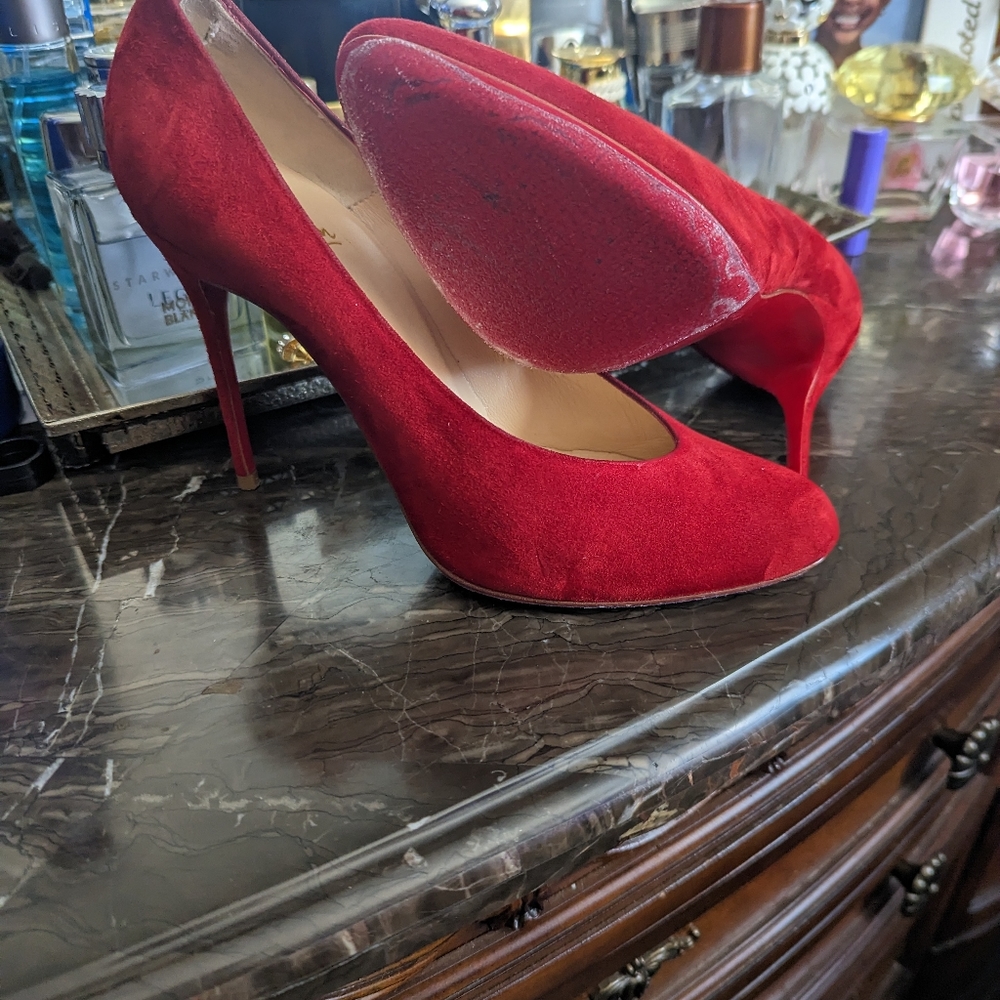 Red Louboutins Suede Pumps